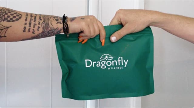 Green product bag from Dragonfly Wellness